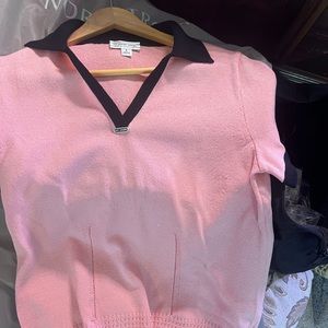 This is a beautiful pink knit top with a black collar!